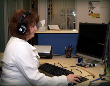 Staff person viewing e-learning module on computer.