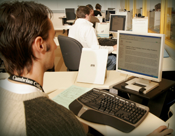 Student at computer.